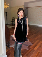 Front view of a black mulberry silk-blend sleeveless tunic top