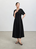 Full-length view of the black Xiangyunsha dress with elbow-length sleeves and a defined waist