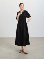 Full-length view of the black Xiangyunsha dress with elbow-length sleeves and a defined waist