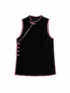 Front view of a black sleeveless tunic top with pink trim and side fastenings