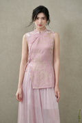 Front view of a blush-pink New Chinese vest featuring a fitted silhouette and asymmetric side-tie closure