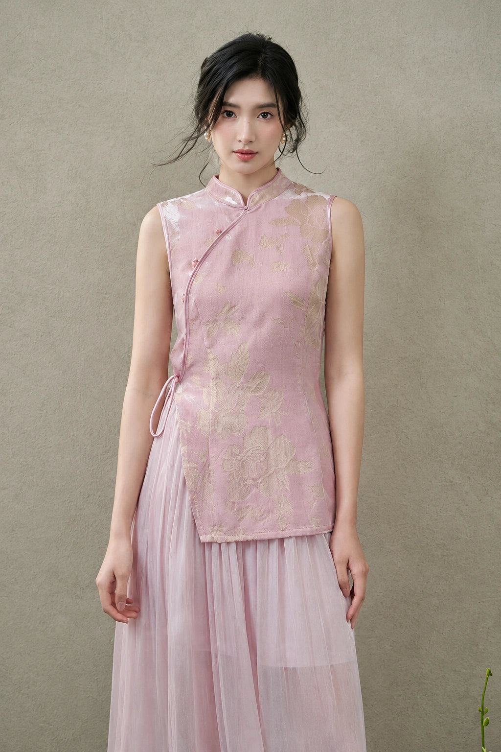 Front view of a blush-pink New Chinese vest featuring a fitted silhouette and asymmetric side-tie closure