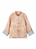 Front view of a blush pink jacquard jacket with long straight sleeves and pale blue cuffs