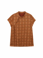 Front view of a brown patterned mulberry silk pullover top with short straight sleeves