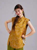 Model wearing a Gambiered Silk butterfly top with a Mandarin collar, flutter shoulders and asymmetric front closure