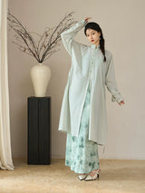 Long lightweight sun protection jacket styled open over a printed dress.