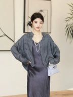 Model wearing a relaxed charcoal mulberry silk jacket with long straight sleeves