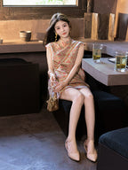 Lifestyle view of a model wearing a coral patterned mulberry silk dress with flutter cap sleeves.