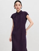 Three-quarter view showing the shaped waist and cap sleeves of a purple mulberry silk qipao dress.