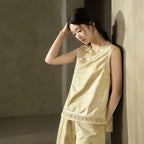 Side view showing the relaxed fit, dimensional floral jacquard, embroidered hem and side slit