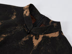 Close-up of the stand collar, frog-button closure and textured floral Xiangyunsha silk fabric