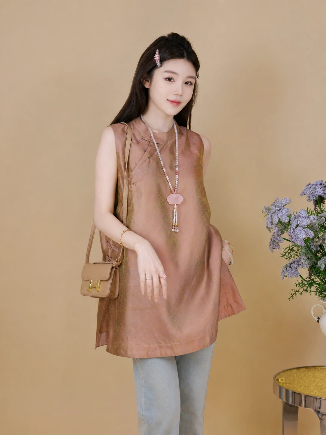 Model wearing a dusty rose heritage-inspired mulberry silk sleeveless top