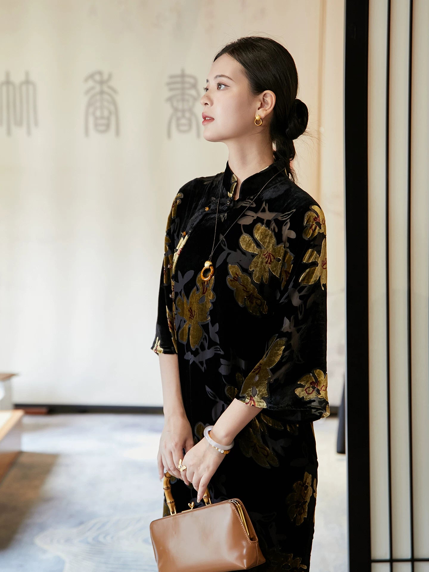 Side profile of elegant floral velvet Mandarin collar midi dress