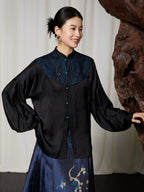 Three-quarter view of the Embroidered Mandarin Collar Viscose Blouse by Gambiered Silk featuring a blue embroidered yoke and relaxed silhouette.
