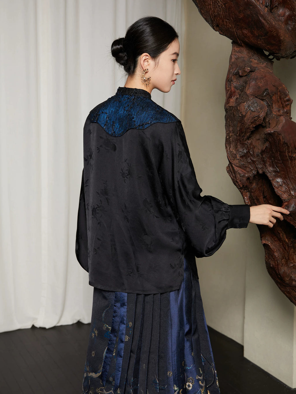 Back view of the Embroidered Mandarin Collar Viscose Blouse highlighting the embroidered shoulder panel and flowing silhouette.