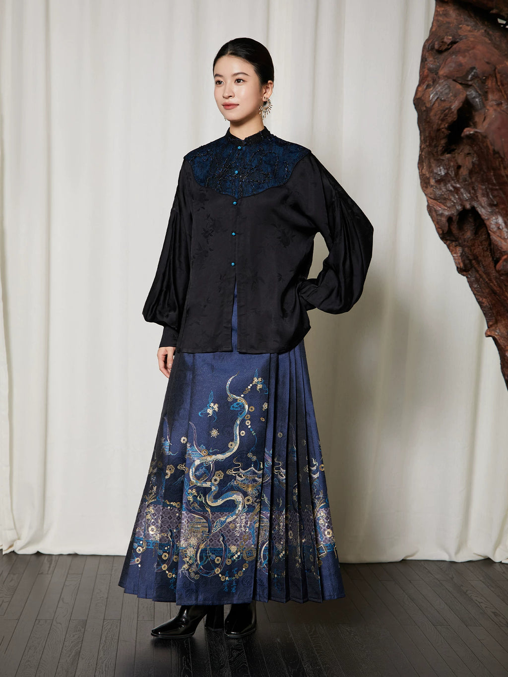 Full-length styling of the Embroidered Mandarin Collar Viscose Blouse paired with a navy embroidered pleated skirt.