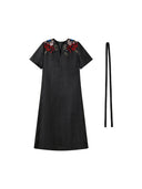 Front product view of the black Xiangyunsha dress with colorful shoulder embroidery and waist tie