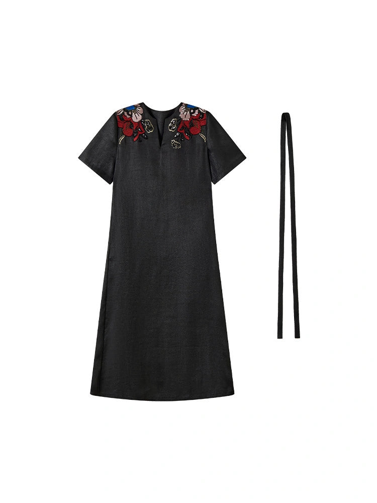 Front product view of the black Xiangyunsha dress with colorful shoulder embroidery and waist tie