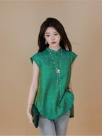 Model wearing a plum purple mulberry silk sleeveless top while seated