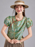 Gambiered Silk silk top featuring butterfly and blossom motifs, puffed short sleeves and contrast piping