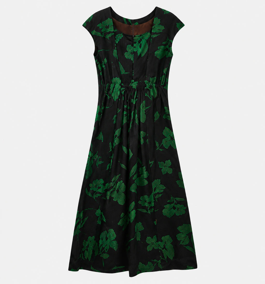 Back view of the black floral silk dress showing its gathered waist and concealed zipper.