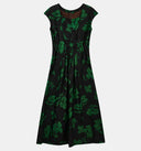 Back view of the black floral silk dress showing its gathered waist and concealed zipper.