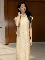 Close-up of floral textured Mandarin collar dress with handmade frog-button closure