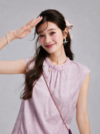 Model wearing a pale lilac sleeveless rayon top with tonal botanical jacquard and neckline beadwork.