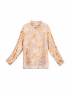Front view of a floral long-sleeve blouse with a mandarin collar and relaxed silhouette