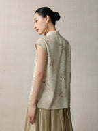 Back view of the Warm Sand floral sleeveless top with botanical print and mandarin collar by Gambiered Silk.