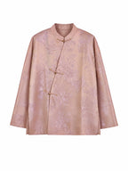 Model wearing a peach pink mulberry silk top with a mandarin collar and Chinese frog closures