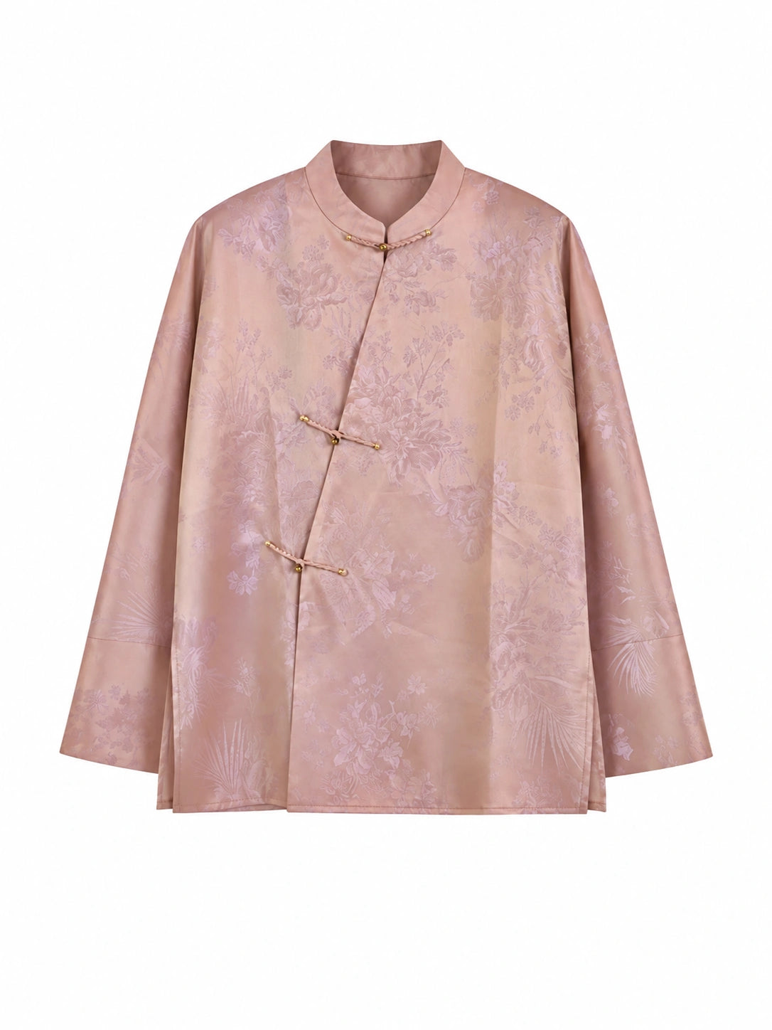 Model wearing a peach pink mulberry silk top with a mandarin collar and Chinese frog closures
