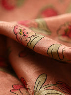 Close-up of coral pink mulberry silk jacquard fabric with woven floral, leaf and rabbit motifs