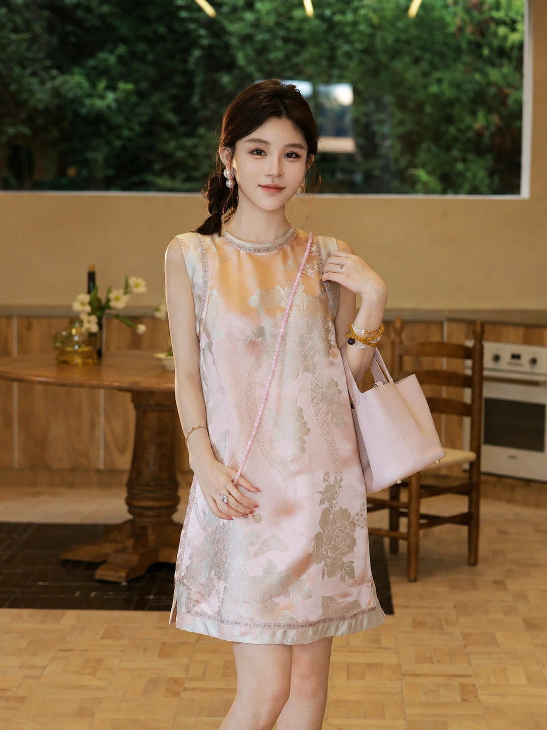 Front model view of Gambiered Silk floral satin dress with round neck and contrast trim