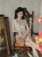 Seated model wearing a lightweight ivory silk-blend dress with pastel flowers and butterflies.