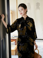 Close-up of floral velvet Mandarin collar dress featuring handcrafted frog-button closure