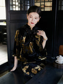 Woman wearing a floral velvet Mandarin collar midi dress in an elegant tea house setting