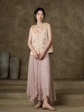 Full-length styled view of the champagne floral vest paired with a pink pleated skirt