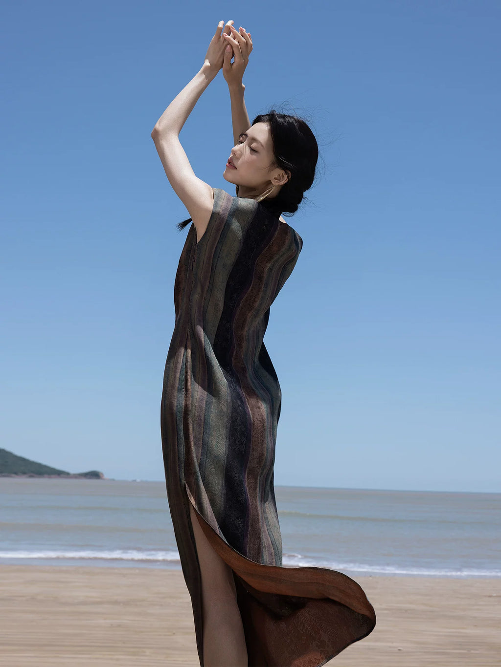 Back view of a flowing Mulberry Silk maxi dress with side slit