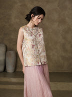 Three-quarter view of the floral jacquard vest with a curved yoke and frog-button closure