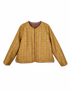 Front view of a gold patterned mulberry silk jacket with long straight sleeves