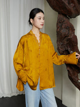 Front view of the Golden Ochre Lyocell Lace Trim V-Neck Blouse featuring lace trim and a flowing relaxed fit.