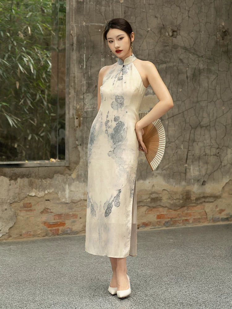 Side view of an ivory silk halter cheongsam with a graceful ink wash print.