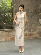 Front view of an ivory halter-neck silk cheongsam featuring an elegant ink-inspired print.