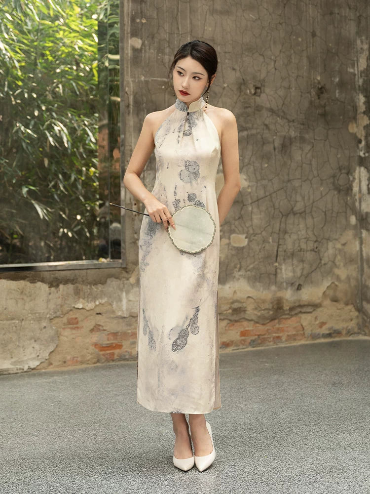 Front view of an ivory halter-neck silk cheongsam featuring an elegant ink-inspired print.