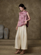Pink horse-motif jacquard vest styled with flowing ivory trousers for a modern New Chinese outfit
