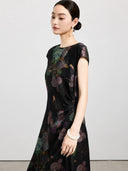 Side view of a black floral silk dress with cap sleeves and gathered waist detail.