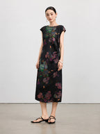 Full-length view of a black New Chinese silk dress with purple and teal hydrangea print.
