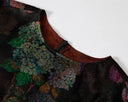 Close-up of the round neckline, concealed back zipper and hydrangea print.