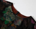 Close-up of the round neckline, concealed back zipper and hydrangea print.